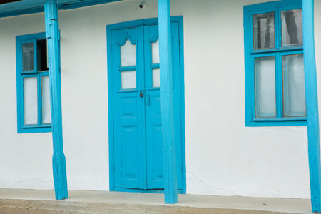Blue wooden door and windows of old house in the town of Trinidad, Cubaの写真素材