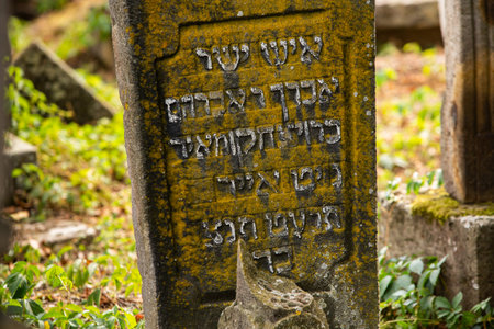 Old stone gravestone in a cemetery with text of faith, hope and hopeの写真素材