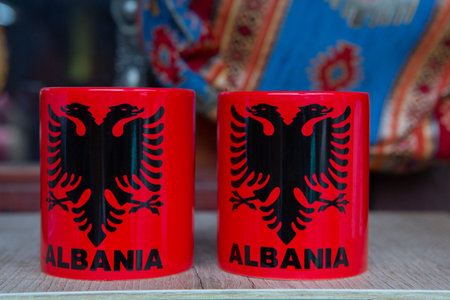 Albania flag on coffee cups on a wooden table. Selective focusの写真素材
