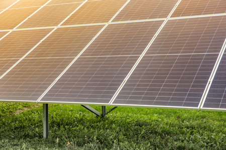 Solar panel on green grass background. Alternative energy source. Alternative energy concept.