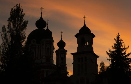 Silhouette of the Church of the Intercession of the Holy Virgin on the Nerl River at sunsetの写真素材