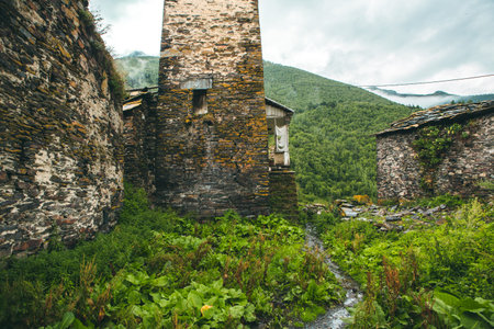 Old abandoned village in Caucasus mountains, Georgia. Toned image.