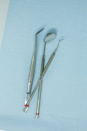 Dental tools on blue background. Dental care concept. Top view.の写真素材