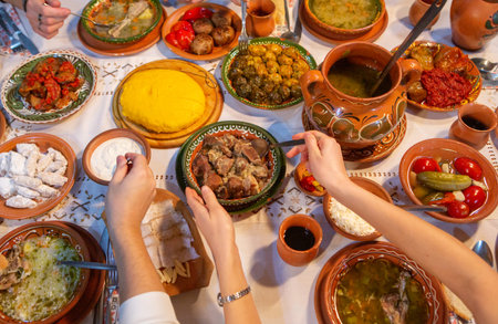 Traditional Turkish and Greek dinner appetizer table with meat, vegetables and olives