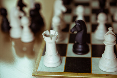 chess board game with black and white figures on the table.の写真素材