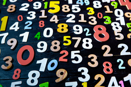 Numbers on a black wooden table. Numbers background. Numbers background.の写真素材