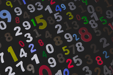 Digital composite of Colorful numbers on black background, 3d render