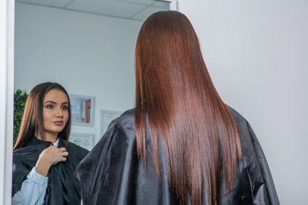 Beautiful young woman in a beauty salon. Hairstyle.の写真素材