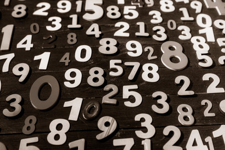 Numbers on a wooden background in black and white. Toned.の写真素材