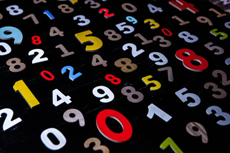 Numbers on a blackboard background, close-up, shallow depth of fieldの写真素材