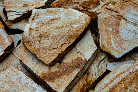 Background of stone wall texture. Close-up. Selective focus.の写真素材