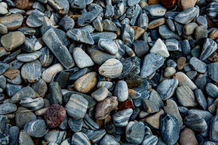 Close-up of a pile of small stones on the beach.の写真素材