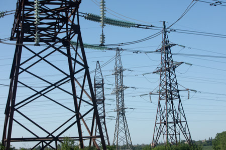 High-voltage power lines on a background of blue sky.