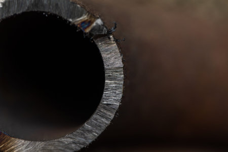 A closeup shot of a metal pipe with a shallow depth of field