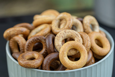 Bagels in a bowl on a wooden table. Selective focus.
