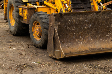 Close up of a heavy duty construction equipment on a construction site.
