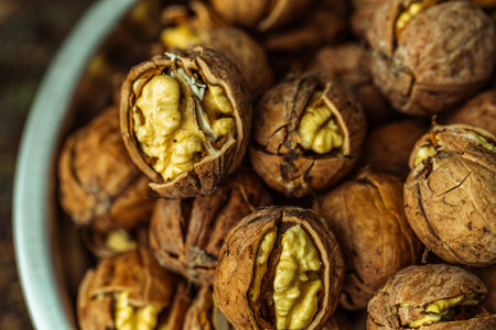 Walnuts in a bowl, close-up, selective focus.