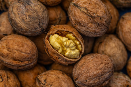 Walnuts in shell close up. Healthy food background. Whole walnut.の写真素材