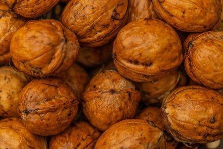 Close-up of a pile of walnuts in the market.