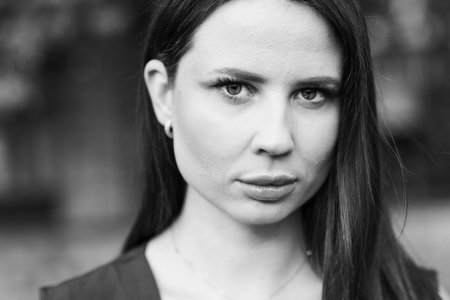 Portrait of a beautiful young brunette woman. Black and white photo.の写真素材