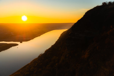 Beautiful sunset over the river. View from the top of the mountain.の写真素材