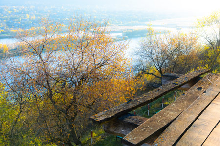 Beautiful autumn landscape with river and wooden pier. View from above.の写真素材