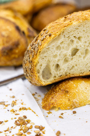 Close up of freshly baked baguette bread with sesame seeds