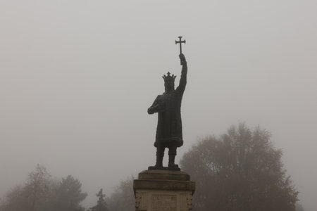 Dreamlike view of Chisinau in fog during sunrise peaceful autumn morning in Moldova.の写真素材
