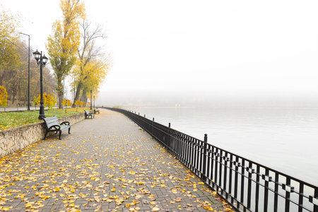 Storytelling image of a city in the Republic of Moldova on a calm autumn morning, wrapped in fog and warm sunrise light highlighting the charm of the capital.の写真素材