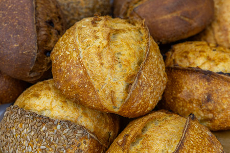 Variety of baked bread on display at a local farmers market.