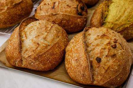Freshly baked bread on the counter of the bakery. Close-up.
