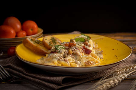 fettuccini carbonara with bacon and white sauceの写真素材
