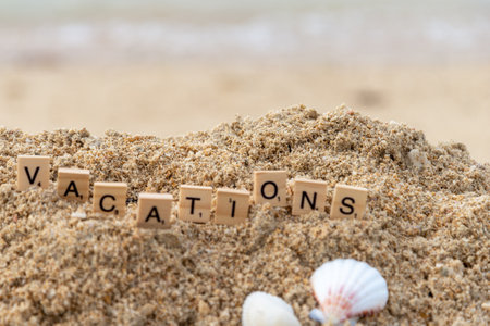 block letters words written on the sand, vacationsの写真素材