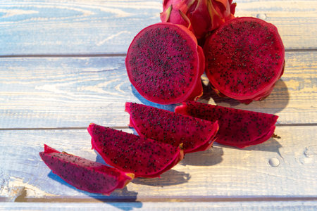 Dragon fruit on a wooden background, close-up, top view