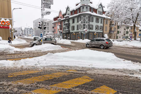 Sankt Gallen, Switzerland - January 15, 2021: Cars in traffic after snowfallのeditorial素材