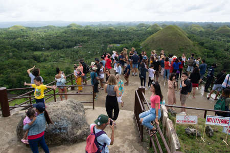1 March 2020, Chocolate Hills, Bohol, Philippines: Tourists at a viewpointのeditorial素材