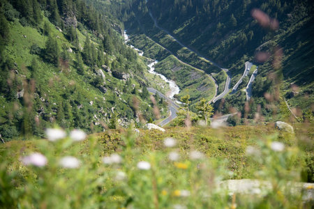 winding pass road in the Swiss Alps surrounded by mountains