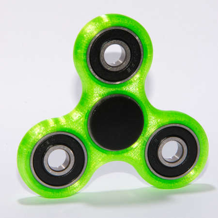 Fidget spinner to relax, relieve stress, playの写真素材