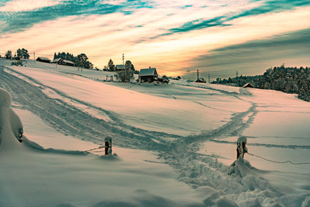 Snow covered field in Switzerland- the perfect weather for hikingの写真素材