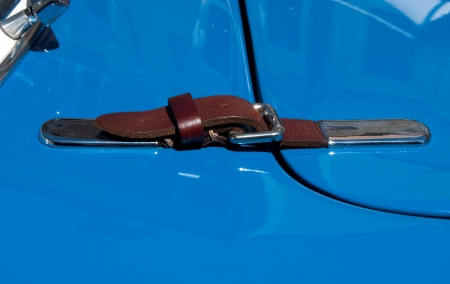   Detail of Hood Belt on a Classic Carの写真素材