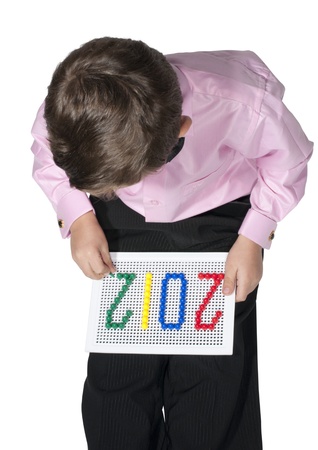 a little boy playing Mosaic isolated on whiteの写真素材