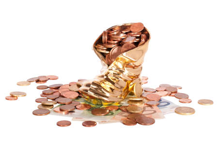 euro coins in shoe isolated on white の写真素材