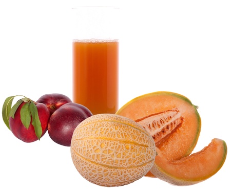 glass of juice, peach and melon on a white backgroundの写真素材