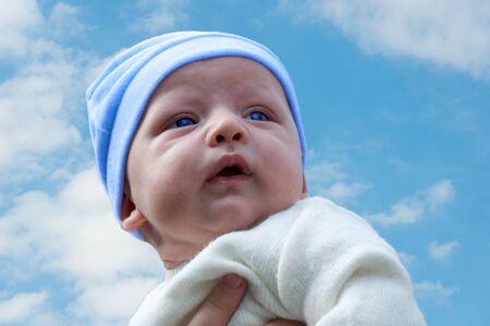 baby against the skyの写真素材