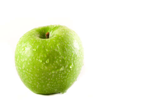 green apple isolated on white background with copy spaceの写真素材