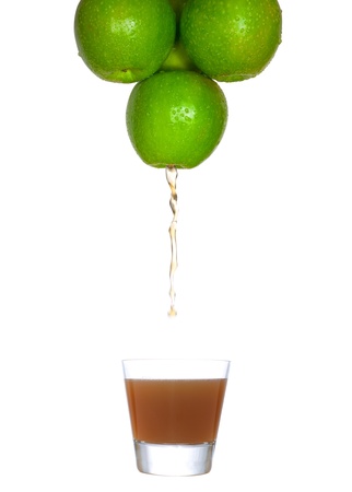 juice flowing from the apple to the glassの写真素材