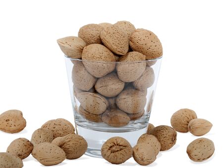 cup with almonds isolated on white backgroundの写真素材