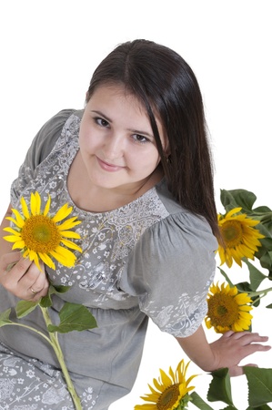 portrait of a beautiful girl with sunflowersの写真素材