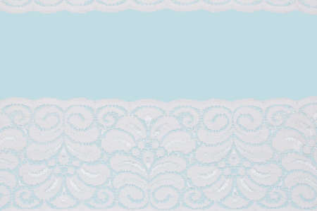 white lace isolated on blue backgroundの写真素材