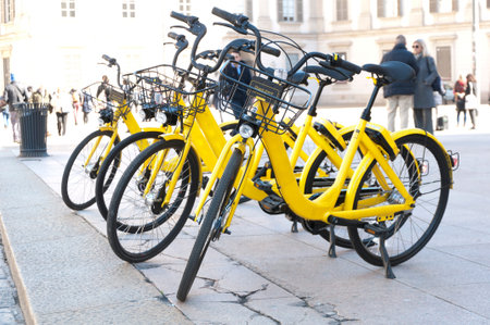 bicycles for hire on the town square in Milan, Italy
